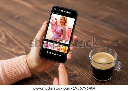 Woman editing photos on mobile phone