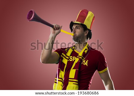 Spanish Fan Celebrating, on a red background.