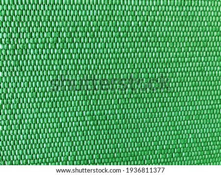The weaving of fibers until it produces small, beautiful patterns. Green rugged background image  