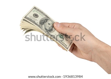 Hold stack 100 dollars in hand on white. Royalty-Free Stock Photo #1936813984