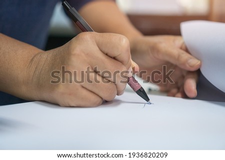 Business people executive signing on official document paperwork files contract on office table for approval management of responsible, signature meeting for startup concept