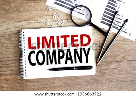 Limited company. text on white paper on wood background Royalty-Free Stock Photo #1936863922