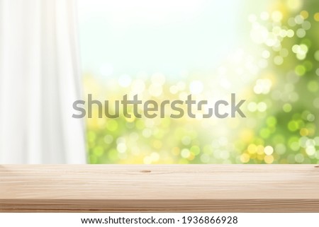 Wooden surface in front of blurry window and curtain in 3d illustration. Stage background for natural product display. Royalty-Free Stock Photo #1936866928