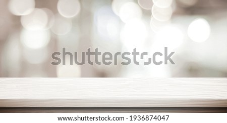 White table presentation, desk and blur background, Empty wood counter, shelf surface over blur restaurant white bokeh background, Wood table top for retail shop, store product display banner, mock up Royalty-Free Stock Photo #1936874047