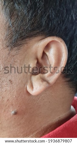 Left ear of Indonesian man