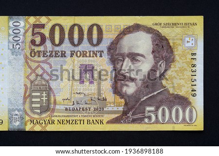 A close-up macro photo of a HUF 5,000 Hungarian banknote. The banknote features a portrait of Count István Széchenyi. Bank image and photo.