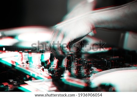 Disc jockey mixing controller on night club party.DJ sound mixer with anaglyph effect.Professional stage audio equipment edited with vintage filter.Download royalty free curated dj images collection