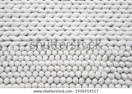 knitted white bath mat or toilet mat texture background, knitting texture. Top view of horizontal Stockinet.  