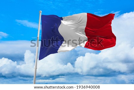 Large French flag waving in the wind Royalty-Free Stock Photo #1936940008