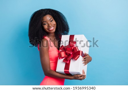 Photo portrait of girl embracing gift box present celebrating birthday party isolated vivid blue color background