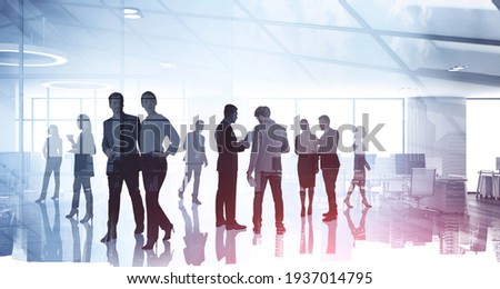 Silhouettes of diverse business people working together, toned image of office interior and skyscrapers. Concept of modern office with managers, partners Royalty-Free Stock Photo #1937014795