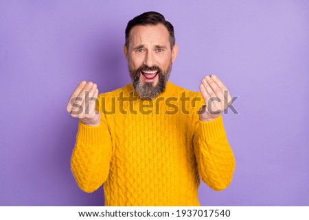 Photo of displeased man hands fingers show money symbol open mouth yell isolated on violet color background