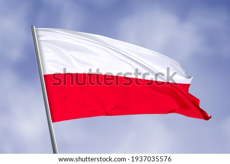Poland flag isolated on sky background. close up waving flag of Poland. flag symbols of Poland. Royalty-Free Stock Photo #1937035576