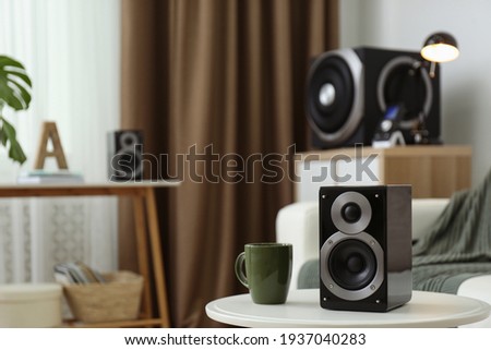 Modern powerful audio speaker system in bright room Royalty-Free Stock Photo #1937040283