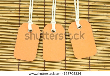 blank price tag hang on bamboo  background