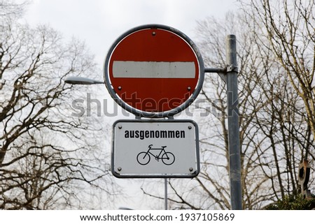 red and white traffic sign, one-way street, motor vehicles are not allowed to pass, except bicycles