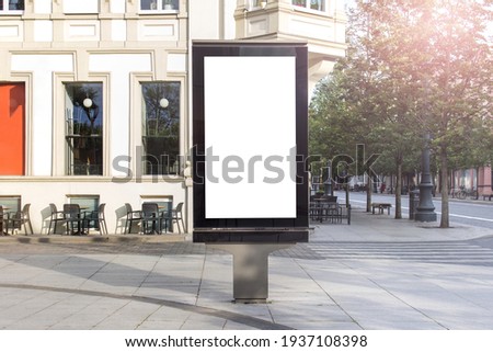 Mockup template of street lightbox stand signboard in the european city center.