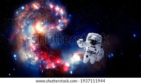 Astronaut spaceman do spacewalk while working for space station in outer space . Astronaut wear full spacesuit for space operation . Elements of this image furnished by NASA space astronaut photos. Royalty-Free Stock Photo #1937111944