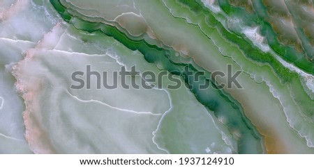 Natural green onyx marble background, polished marble quartz stone background striped by nature with a unique patterning, marble stone for digital wall tiles and floor tiles design, granite marble. Royalty-Free Stock Photo #1937124910