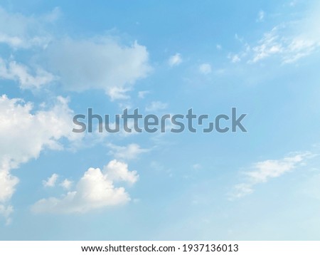 Beautiful clouds during spring time in a Sunny day. Blue sky and white fluffy clouds. Royalty-Free Stock Photo #1937136013