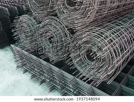 Rolls of iron mesh (wire mesh) use for reinforce concrete in construction site Royalty-Free Stock Photo #1937148094