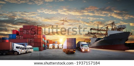 Logistics and transportation of Container Cargo ship and Cargo plane with working crane bridge in shipyard at sunrise, logistic import export and transport industry background Royalty-Free Stock Photo #1937157184