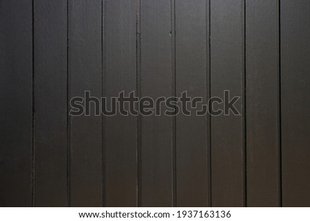 Selective focus of texture of the brown wood wall.