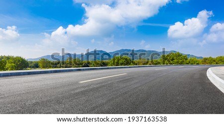 country road and green mountains in summer. Royalty-Free Stock Photo #1937163538