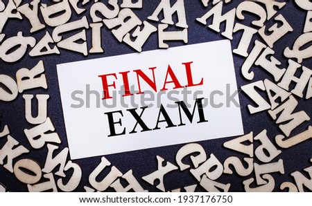 On a light background, wooden letters of the English alphabet and a white card inside with the words FINAL EXAM