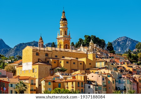 View of colorful houses and belfry of the Saint Michel Archange basilica in old town of Menton - small town on French Riviera. Royalty-Free Stock Photo #1937188084