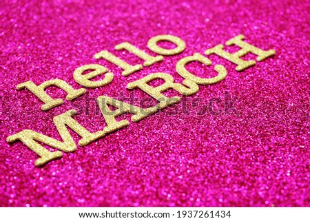 Hello March alphabet letters on pink glitter background