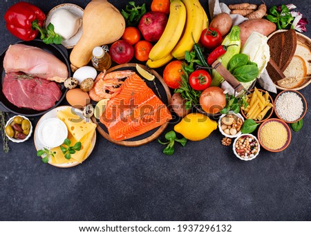 Mediterranean diet. Healthy balanced food. Paleo or flexitarian organic eating with fruit, vegetables, seafood and meat Royalty-Free Stock Photo #1937296132