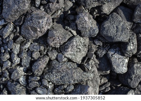 Large shiny lumps of coal. Mineral, mineral fuel for home stoves and boilers in a country house. Natural background. Royalty-Free Stock Photo #1937305852