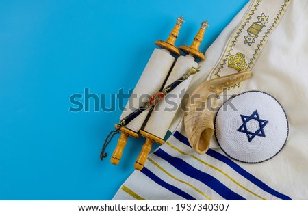 Jewish prayer book with torah scroll and shofar horn, prayer shawl tallit Orthodox religious symbols Royalty-Free Stock Photo #1937340307