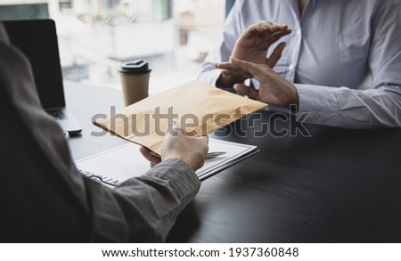 Businessmen refuse to accept money bribery or fraud or cheat, Combating Illegal Receiving of Money and Social Injustice, Anti bribery and corruption concept. Royalty-Free Stock Photo #1937360848