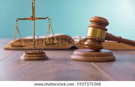 law concept, scales with judge gavel and law book
