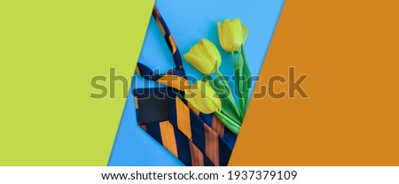 men's tie, flower tulip on a colored background