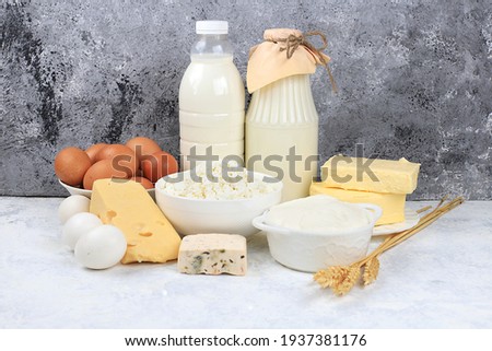 Assortment of fresh dairy products, healthy breakfast with ingredients, natural nutrition concept, maintaining healthy intestinal microflora, diet food, rustic table,