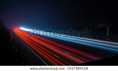 Light trails long exposure highway Royalty-Free Stock Photo #1937389168