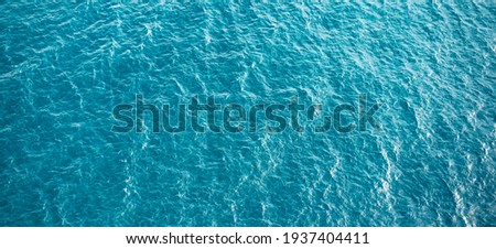 Blue turquoise sea water background. Aerial view Royalty-Free Stock Photo #1937404411