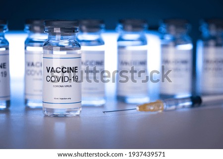 Vials with Covid-19 coronavirus vaccines and syringe