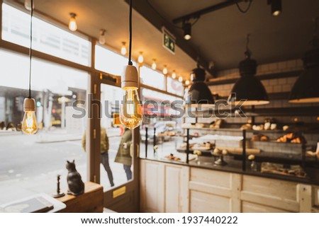 Pastries shop vintage cafe interior lighting decor, old Vintage light bulb lamps Royalty-Free Stock Photo #1937440222
