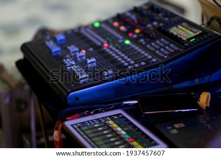 sound check for concert, mixer control, music engineer, backstage 
