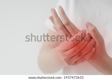 Women holds her hand in pain. Healthcare concept. 
