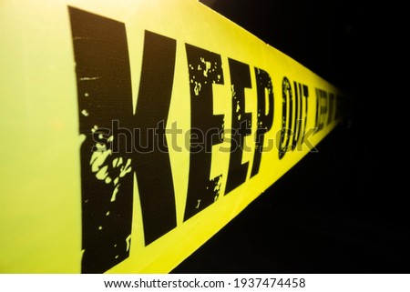 Close-up view of keep out tape against dark background, shot with macro probe lens