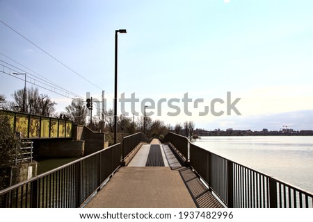 Panoramic walkway above a lake in an italian town in early spring
