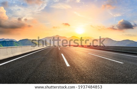 Country road and mountain in summer at sunset. Royalty-Free Stock Photo #1937484853