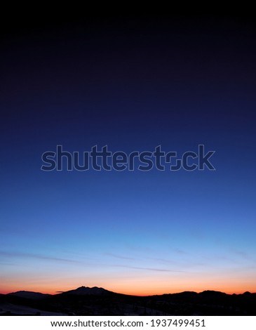 The silhouette of Mt. Shari and the beautiful gradation of the dawn sky in eastern Hokkaido, Japan.
