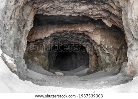 The entrance to the old abandoned limestone adits. Royalty-Free Stock Photo #1937539303