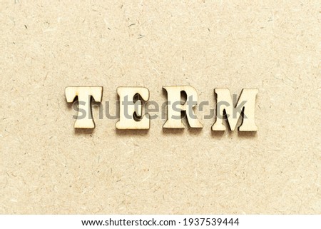 Alphabet letter in word term on wood background